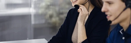 Woman smiling while holding headset microphone